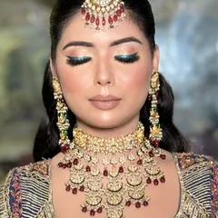 Another shot of the blue eyeshadow, showing how it catches the light and adds a modern twist to a traditional outfit.
