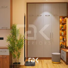 This entryway storage solution combines a full-height wardrobe, a bench with drawers, and a beautifully lit vanity corner. The mix of grey and wood finishes creates a modern and welcoming first impression.