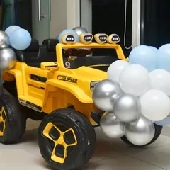 Another one of our rental jeeps, this one in bright yellow, decorated with balloons to match the party theme.