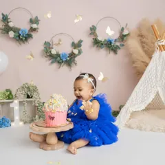 That happy moment of discovery. This little one is having the best time exploring her first birthday cake in our Bangalore studio.