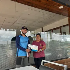 A participant receiving her certificate from our trek leader. This personal touch and recognition is an important part of the Miles To Trek experience.