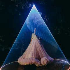 I use laser light projections to create dramatic, focused spotlights for grand entrances or performances. This effect, seen here at a wedding reception, adds a theatrical and high-end feel to your special moment.