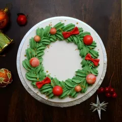 A top-down view of the Christmas wreath cake. It's a simple yet festive design that's perfect for holiday celebrations.