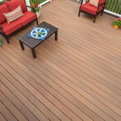 An overhead view of a composite deck, a durable and low-maintenance alternative to natural wood. This material is perfect for creating a clean, uniform look for patios and seating areas.