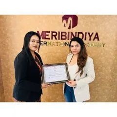 Presenting a certificate to a deserving student. It's a privilege to guide talented individuals and help them achieve their dreams.