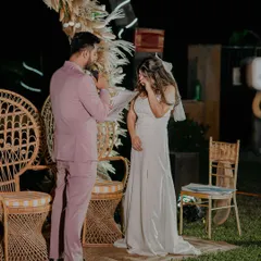 An emotional moment during the ring ceremony as the groom speaks to his bride, capturing the heartfelt promises of their engagement.