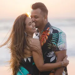 The golden hour light, the sea breeze, and a happy embrace. This is the essence of a beach pre-wedding shoot, full of warmth and genuine affection.
