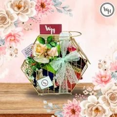 This unique custom hamper is presented in a golden, hexagonal birdcage-style basket. It's a perfect example of how I use creative packaging to make a gift for any celebration truly stand out.