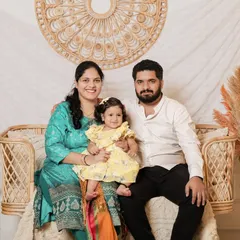 This family portrait showcases how our boho setting complements traditional Indian attire beautifully. The vibrant colors of their outfits pop against the neutral, textured background.