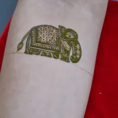 Even a single element can be a work of art. Here is a close-up of a decorated elephant motif, a popular figure in bridal designs. We practice these figures individually to perfect their form and detail.