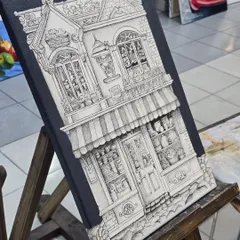 Our workshops also delve into the world of precise line work. This intricate architectural piece, created with a micron pen, shows the patience and skill our students develop in creating detailed illustrations.