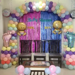 For this baby shower, the family wanted a soft, pastel color theme. I created a full balloon arch with a mix of pastel colors and a shimmering curtain backdrop, perfect for photos with guests.
