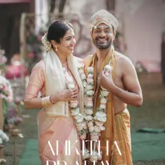 A joyful portrait of a couple after their South Indian wedding ceremony. Their smiles and relaxed posture reflect the happiness of the moment.