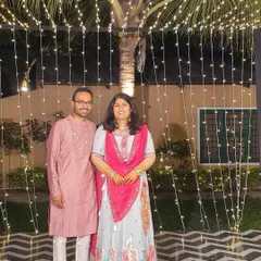 A lovely couple dressed for a festive occasion. The lady is wearing our custom pastel lehenga with a vibrant pink dupatta.