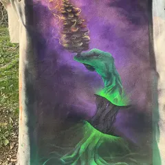 A canvas I painted inspired by my time in the mountains. It's a surreal piece with a burning pine cone and glowing roots, straight from nature.