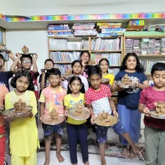 Look at these proud faces! During our festive workshops, children get to connect with culture through creativity. Here, a group of young artists proudly shows off the eco-friendly Ganesha idols they sculpted with their own hands.