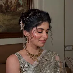 This angle highlights the soft tendrils I left out to frame the face, adding a touch of softness to the structured updo.