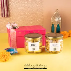 A festive product shoot for a gifting brand. The bright colors, traditional lantern, and marigold flowers immediately create a celebratory mood perfect for Diwali or other holidays.