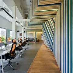 For the Kadence Office, we translated the company's identity into a physical space. The design is built around the concept of soundwaves, with coded striations flowing through the office to create a vibrant, immersive environment that is unique to the brand and supports a creative workflow.