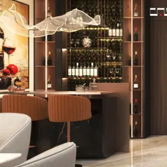 A luxurious home bar setup featuring a dark marble counter, elegant bar stools, and a stunning, abstract light fixture that serves as a piece of art.