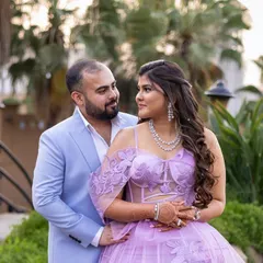 A sweet couple portrait. Kajol's glowing skin and soft purple eyeshadow tones tie in perfectly with her stunning gown.