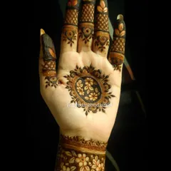 This minimalist design features a floral mandala on the palm and a matching floral cuff on the wrist, leaving the fingers open for a clean, modern look.