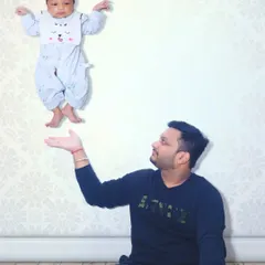 Let's create something fun for the family. This is a creative edit where I made the baby appear to be floating in the air, creating a magical and memorable father-child portrait.