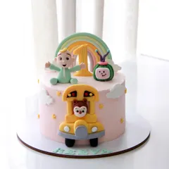 The cutest Cocomelon theme cake for a 1st birthday. This design features JJ, the iconic melon, and the yellow school bus, all handcrafted to bring the beloved show to life.