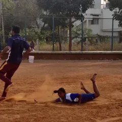 The perfect dive. This is the result of hours of practice, a player stretching his entire body to tag a defender just in time on our authentic dirt court.