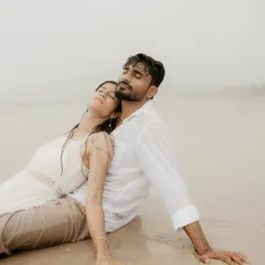 Lost in the moment on a misty beach. This is what pure, unscripted romance looks like. The soft light and the sound of the waves created a perfect atmosphere for this serene and intimate portrait.