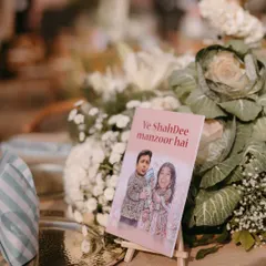 We believe your wedding should feel like you. This custom placard with the playful phrase 'Ye ShahDee manzoor hai' is a perfect example of how we weave your personality and inside jokes into the decor, making the celebration uniquely yours.