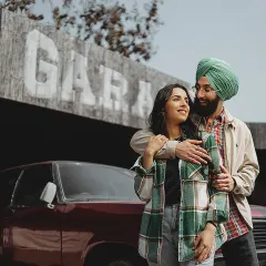 A cool and casual shot of Manpreet and Simran in front of a vintage garage set. This shows our ability to create concept shoots that reflect a couple's unique style.