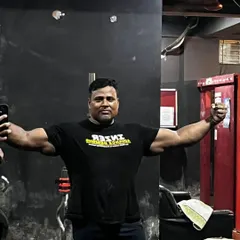A quick pose to check the arm and shoulder development. Building a powerful upper body is key for a massive bench press.