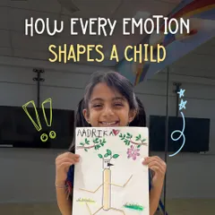Every emotion helps shape a child. This young artist is proudly displaying her work, a moment of joy and accomplishment that boosts her confidence and self-esteem.