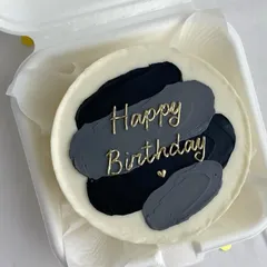 For those who love a modern aesthetic, we create designs like this artistic brushstroke bento cake. The blend of black and grey tones with elegant gold script offers a chic and stylish way to celebrate.