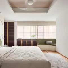 In this master bedroom, I integrated form and function with custom floor-to-ceiling wardrobes in a bold, dark finish with brass accents. The design is complemented by a custom window seat with built-in storage, creating a cozy reading nook that is both beautiful and practical.