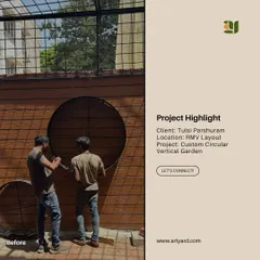 Before: My team at work installing the framework for a custom circular vertical garden. This shows the initial construction phase of a bespoke garden feature.