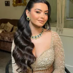 A close up of classic Hollywood waves. This style is all about shine, structure, and volume. I style each wave carefully to create this uniform, glamorous effect that is perfect for an evening event.