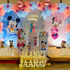 Full view of the adorable Mickey and Minnie Mouse themed stage decoration, perfect for celebrating twins or any Disney fan.