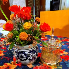 It's the small details that bring a theme to life. For this Turkish-inspired Haldi, I used hand-painted ceramic vases and bright orange flowers as table centerpieces to carry the theme throughout the venue.