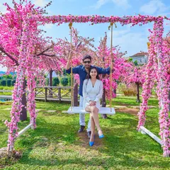 A fun and playful shot on our cherry blossom swing set, perfect for capturing the happy and carefree side of your relationship.