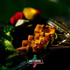 A close-up of my grilled paneer tikka skewers, showcasing the vibrant colors of the bell peppers and the perfect char on the paneer. A vegetarian delight for any event.