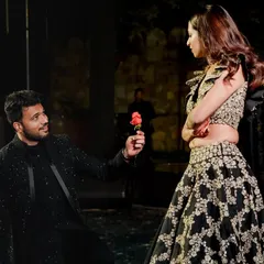 A classic romantic moment woven into the choreography. This groom's proposal with a rose adds a sweet, personal touch to their sangeet performance, making it more than just a dance.