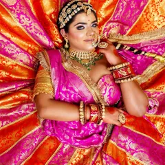 This stunning top-down shot captures the full splendor of the bridal lehenga and the radiant makeup, a key shot for any professional portfolio.