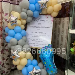 A custom welcome board for a Kuan Pujan ceremony. I framed the personalized sign with a gentle arch of pastel balloons and star foils, creating an elegant entrance for guests at this special naming function.