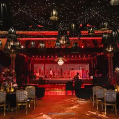 This luxe red-and-black sangeet setup was designed to be dramatic, elegant, and bold. The geometric neon stage, starry night ceiling, and rich textures came together to create a visual masterpiece for a night of high-energy celebration in Udaipur.