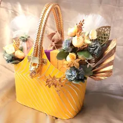 Another view of the versatile festive basket. The golden handle and rich fabric make it a luxurious choice for any Indian festival.
