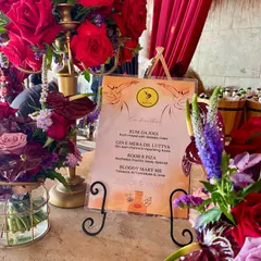 A custom cocktail menu with fun, desi-themed drink names like 'Rum Da Jogi' and 'Gin E Mera Dil Luteya'. We love getting creative and tailoring the menu to reflect the personality of your event.