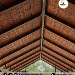 An upward view of a beautifully crafted Mangalore tile ceiling. The patterned tiles are laid with precision, showcasing the rich texture and earthy tones that make this roofing style so appealing.
