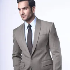 An example of a bespoke blazer with a distinctive shawl lapel, crafted in a versatile light grey fabric. This is a great option when you want a formal look that stands apart from a standard business suit.